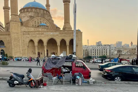 BBC People living in a van in front of Mohammad Al-Amin Mosque