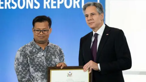 Getty Images US Secretary of State Antony Blinken stands with Mech Dara, a 2023 Trafficking in Persons (TIP) Report Hero, for his work in Cambodia