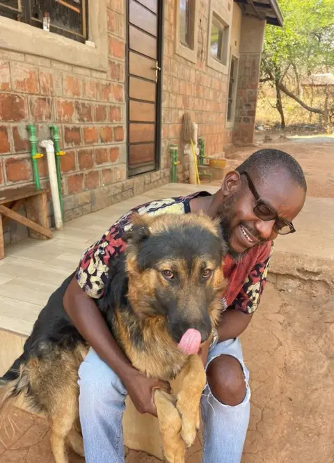 BBC / Kennedy Gondwe Kennedy with his dog