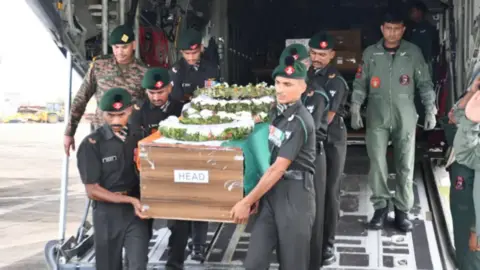 Defence PRO, Thiruvananthapuram Indian army soldiers carry a casket with Cherian Thomas' body