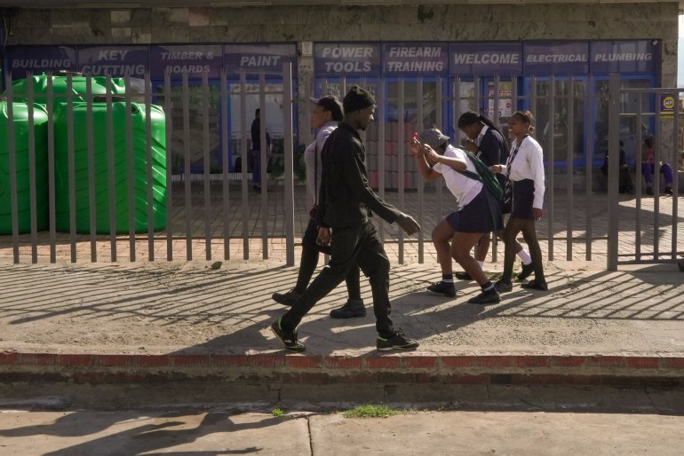 School kids walk through the city center