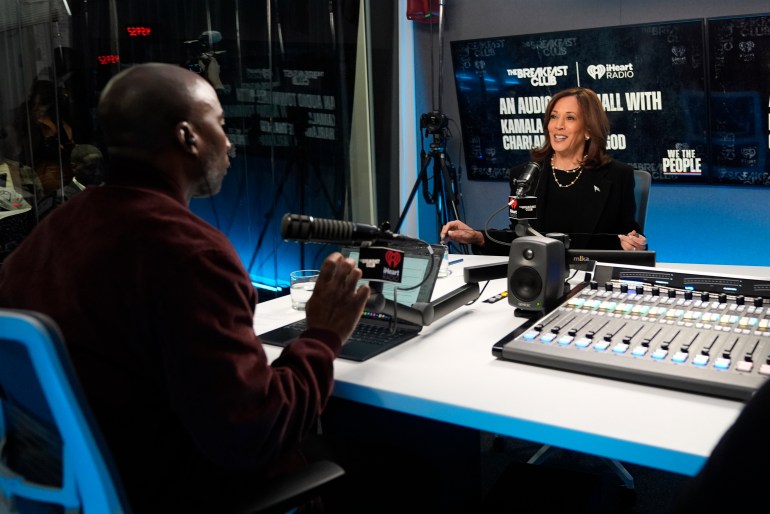 Charlamagne tha God interviews Kamala Harris in a radio studio