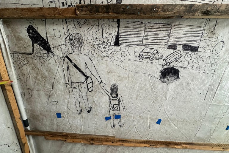 A drawing from one of Hussam's displaced children shows the family returning home 