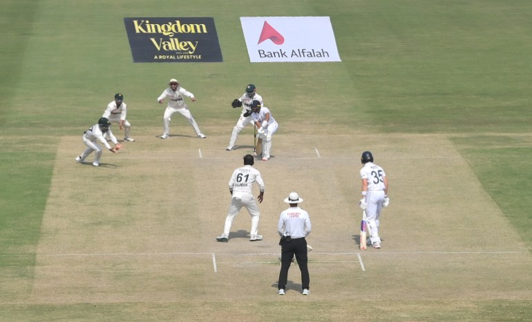 MULTAN, PAKISTAN - OCTOBER 18: Pakistan fielder Abdullah Shafique dives to catch out England batsman Shoaib Bashir off the bowling of Noman Ali to win the match during day four of the Second Test Match between Pakistan and England at Multan Cricket Stadium on October 18, 2024 in Multan, Pakistan. (Photo by Stu Forster/Getty Images)