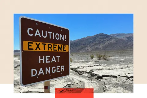 A sign in an arid landscape reads: 'Caution! Extreme heat danger"