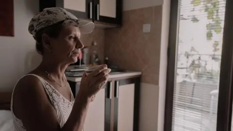 Valentina sitting in her former room at Pristaniste