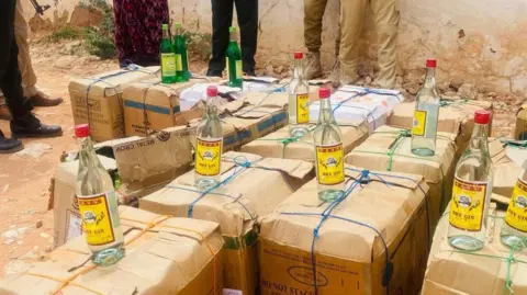 Somalia Police Bottles of alcohol on top of boxes