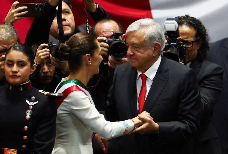 Andres Manuel Lopez Obrador greets President Claudia Sheinbaum at her inauguration ceremony