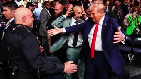 Getty Images Donald Trump greets Joe Rogan at UFC 309