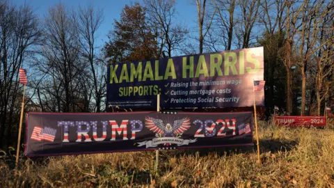 Getty Images Campaign signs for Republican presidential nominee, former U.S. President Donald Trump and Democratic presidential nominee, U.S. Vice President Kamala Harris