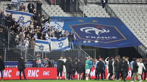 AFP Head coach of Israel, Ran Ben Simon celebrates with his players and fans after the UEFA Nations League 2024/25 League A Group A2 match between France and Israel at Stade de France on November 14, 2024 in Paris, France. 