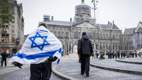 EPA Man wearing israeli flag walks in central Amsterdam