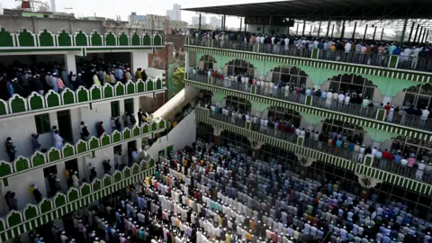 Getty Images NOIDA, INDIA - MARCH 15: Muslim devotees offer prayers on the occasion of first Friday of the holy month of Ramadan at a mosque at Sector 8, on March 15, 2024 in Noida, India. Every year, the ninth month of the Islamic calendar is observed with a lot of dedication, community service and peace by the Muslim community all over the world. Muslims, during this time of the year, keep fast from dawn to sunset. They consume a pre-dawn meal suhur, and then break their fast after sunset with dates and water. (Photo by Sunil Ghosh/Hindustan Times via Getty Images)
