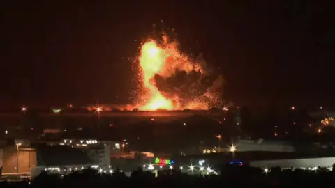 Reuters A fireball over the night sky in Beirut.