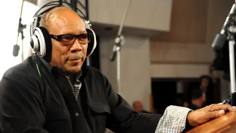 Getty Images Quincy Jones in the studio with his headphones on