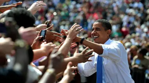 Getty Images Barack Obama greets voters at a rally during 2008 presidential campaign