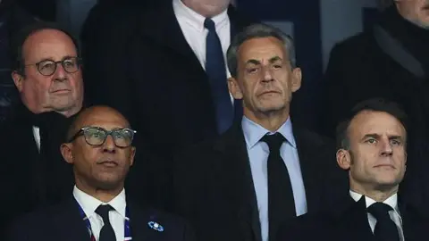 AFP (1st row from L) French Football Federation (FFF) President Philippe Diallo, France's President Emmanuel Macron, (second row from L) former French President Francois Hollande and former French President Nicolas Sarkozy stand ahead of the UEFA Nations League League A, Group A2 football match between France and Israel at The Stade de France stadium in Saint-Denis, in the northern outskirts of Paris, on November 14, 2024. (