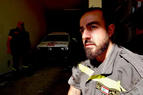 Darren Conway / BBC Samir El Chekieh is a firefighter and paramedic with the Lebanese Civil Defense Force