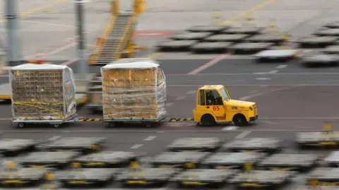 Getty Images  A vehicle transports air mail over the grounds of the DHL hub at the airport in Leipzig on March 07, 2019 in Leipzig, Germany