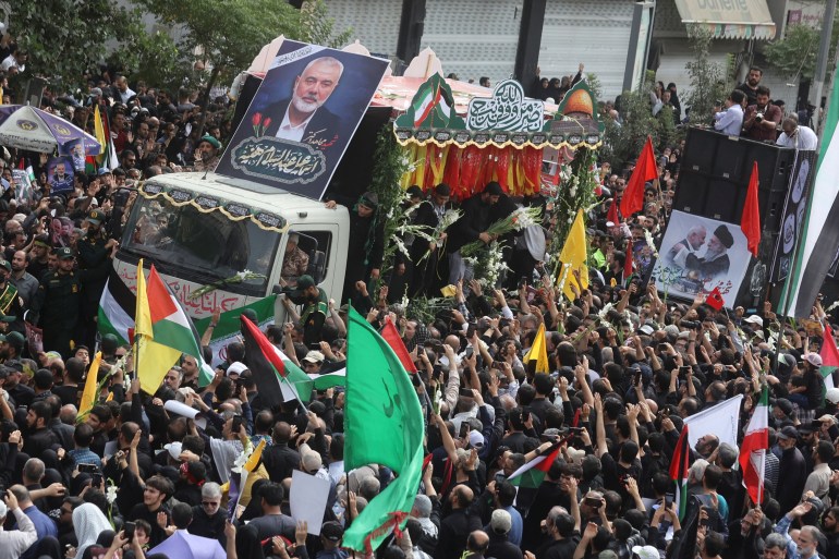 Iranians attend the funeral procession of assassinated Hamas chief, Ismail Haniyeh in Tehran, Iran, August 1, 2024. Majid Asgaripour/WANA (West Asia News Agency) via REUTERS ATTENTION EDITORS - THIS IMAGE HAS BEEN SUPPLIED BY A THIRD PARTY.