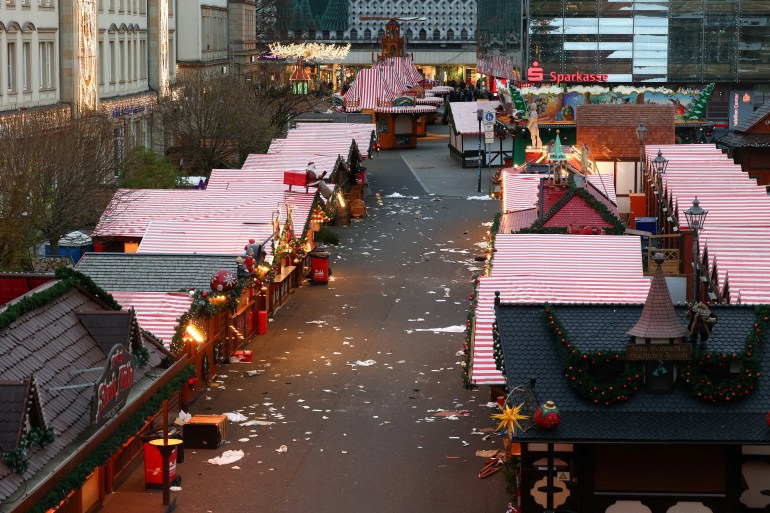 Closed stalls stand at the site where a car drove into a crowd at a Magdeburg Christmas market in Magdeburg,