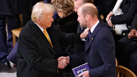 Reuters US President-elect Donald Trump shakes hands with Britain's Prince William inside Notre-Dame Cathedral