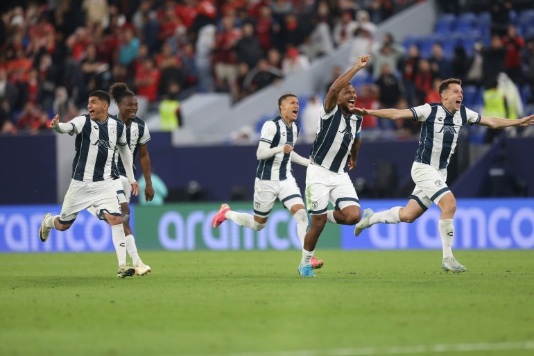 Pachuca's players celebrate after defeating Al Ahly FC in a penalty shootout during the Intercontinental Cup soccer match at Stadium 974 in Doha, Qatar, Saturday, Dec. 14, 2024. (AP Photo/Hussein Sayed)