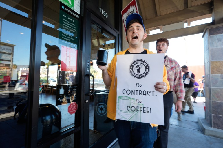 Starbuck workers picket outside of a closed Starbucks in Burbank, California