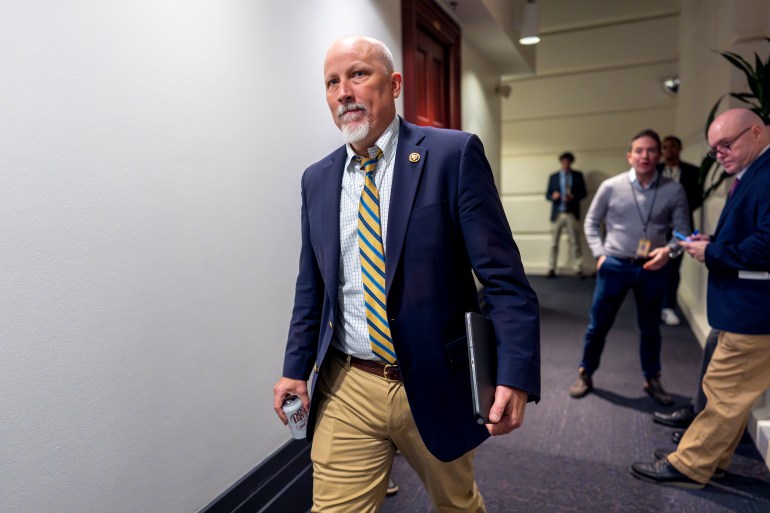 Chip Roy of Texas walks through a hall