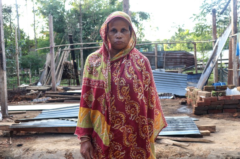 Atarun Nessa in front of her home which was burned to the ground by a large Hindu mob on 7 October