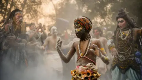 Ankit Srinivas A group of ash-smeared Hindu holy men performing rituals at the Mahakumbh