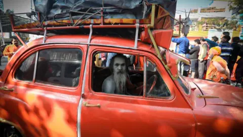 Ankit Srinivas Another holy man arriving in his decorated vintage red car