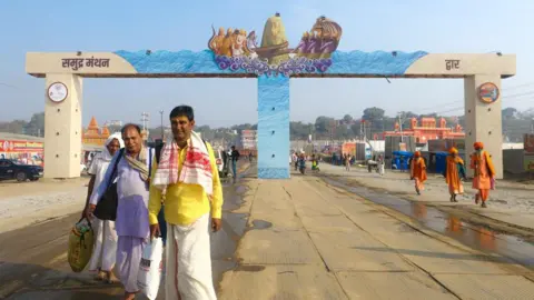 Ankit Srinivas Two pilgrims walking to the festival