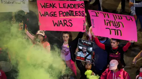 Reuters People protest against the Israeli government's failure to bring home hostages held by Hamas in Gaza, at a demonstration in Tel Aviv, Israel (11 January 2025)