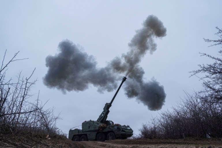 A Ukrainian self-propelled howitzer Dita of Azov brigade fires towards Russian positions at frontline in Donetsk region, Ukraine, Thursday Jan. 23, 2025. (AP Photo/Evgeniy Maloletka)