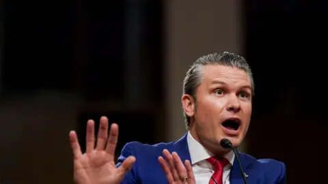 Getty Images Pete Hegseth gesticulates as he addresses the Senate Armed Service Committee for his defence secretary confirmation hearing 