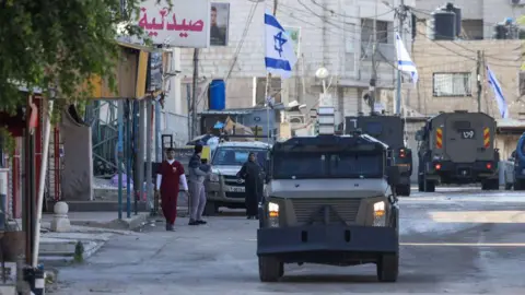 AFP Israeli military vehicles in Jenin, in the occupied West Bank (21 January 2025)