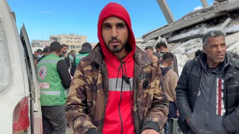 Osama Saleh, who lives in Rafah, looks shocked into the camera