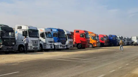 Reuters Aid lorries parked at El-Arish, near Egypt's border with Gaza (16 January 2025)